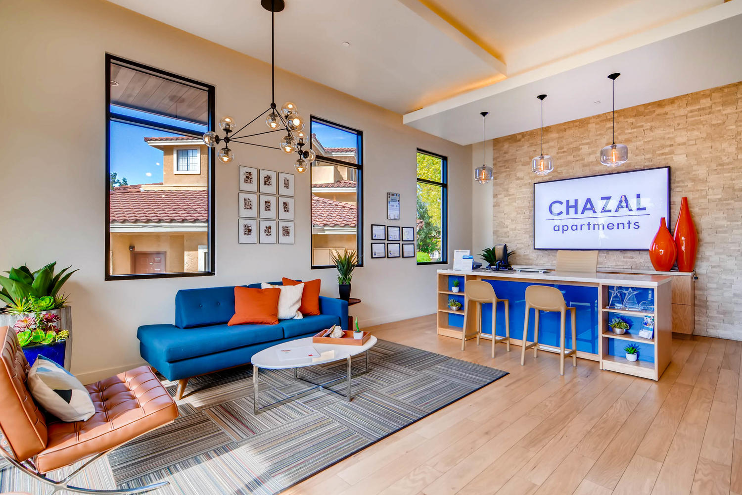 Leasing office lobby with lounge seating and reception desk