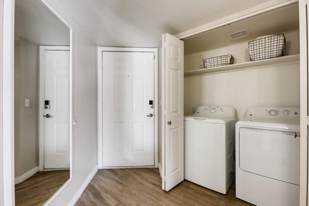 Washer and dryer in a closet by the entrance